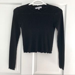 Long Sleeve Ribbed Black Crop Top with Lettuce Hem from Dillard’s